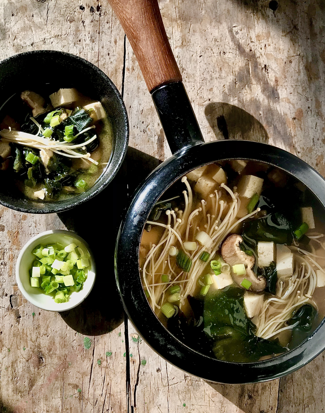 Miso Soup with Wakame Seaweed, Tofu, and Mushrooms in a bowl.